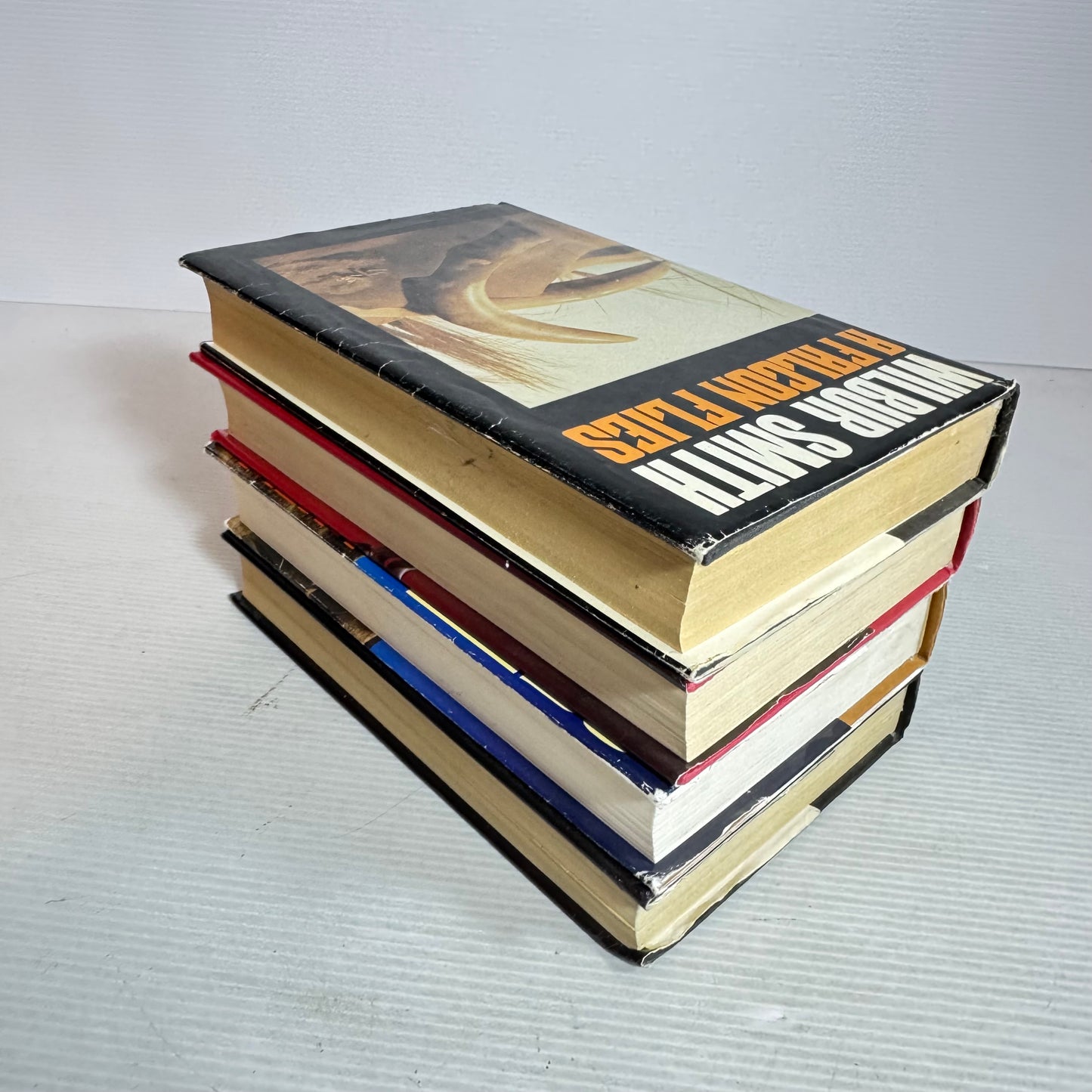 Wilbur Smith Vintage Medium Hardcover x 4 : The Leopard Hunts In the Darkness, Men of Men, A Falcon Flies, The Burning Shore (Vintage 1980's)(2967)