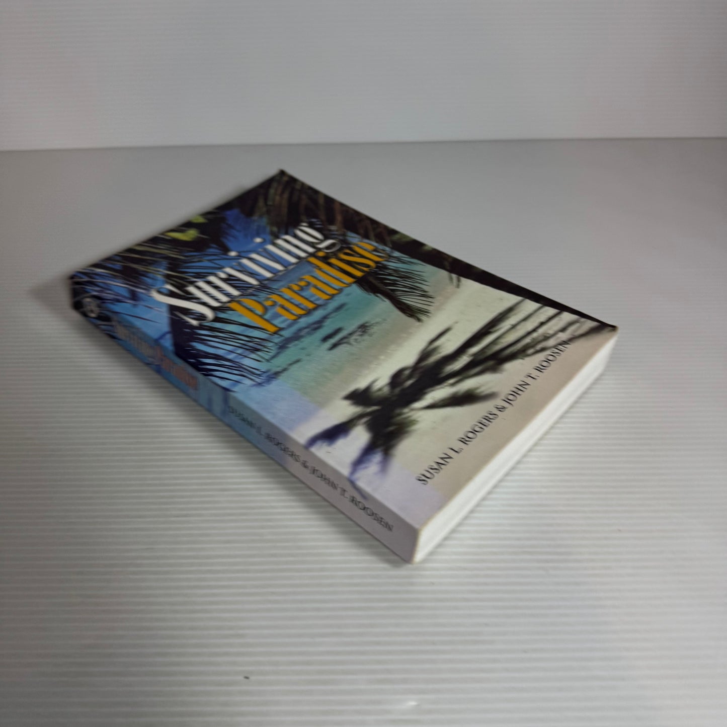 Surviving Paradise - Susan L. Rogers & John T. Roosen
