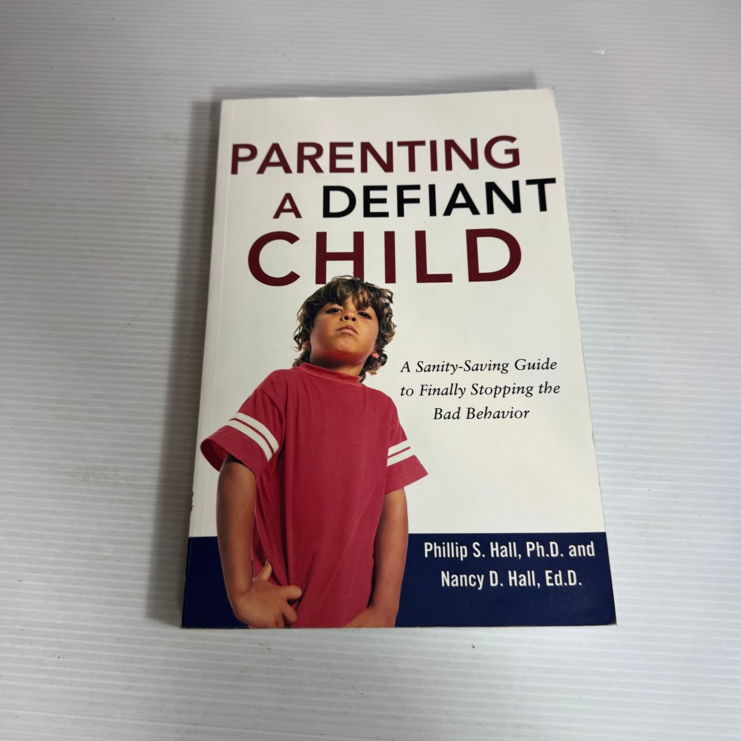 Parenting A Defiant Child : A Sanity-Saving Guide to Finally Stopping the Bad Behaviour - Phillip S. Hall Ph.D. and Nancy D. Hall, Ed.D.