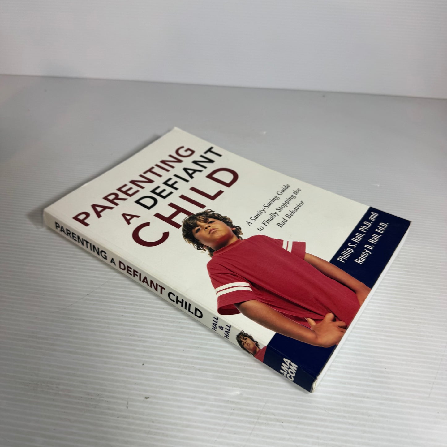 Parenting A Defiant Child : A Sanity-Saving Guide to Finally Stopping the Bad Behaviour - Phillip S. Hall Ph.D. and Nancy D. Hall, Ed.D.