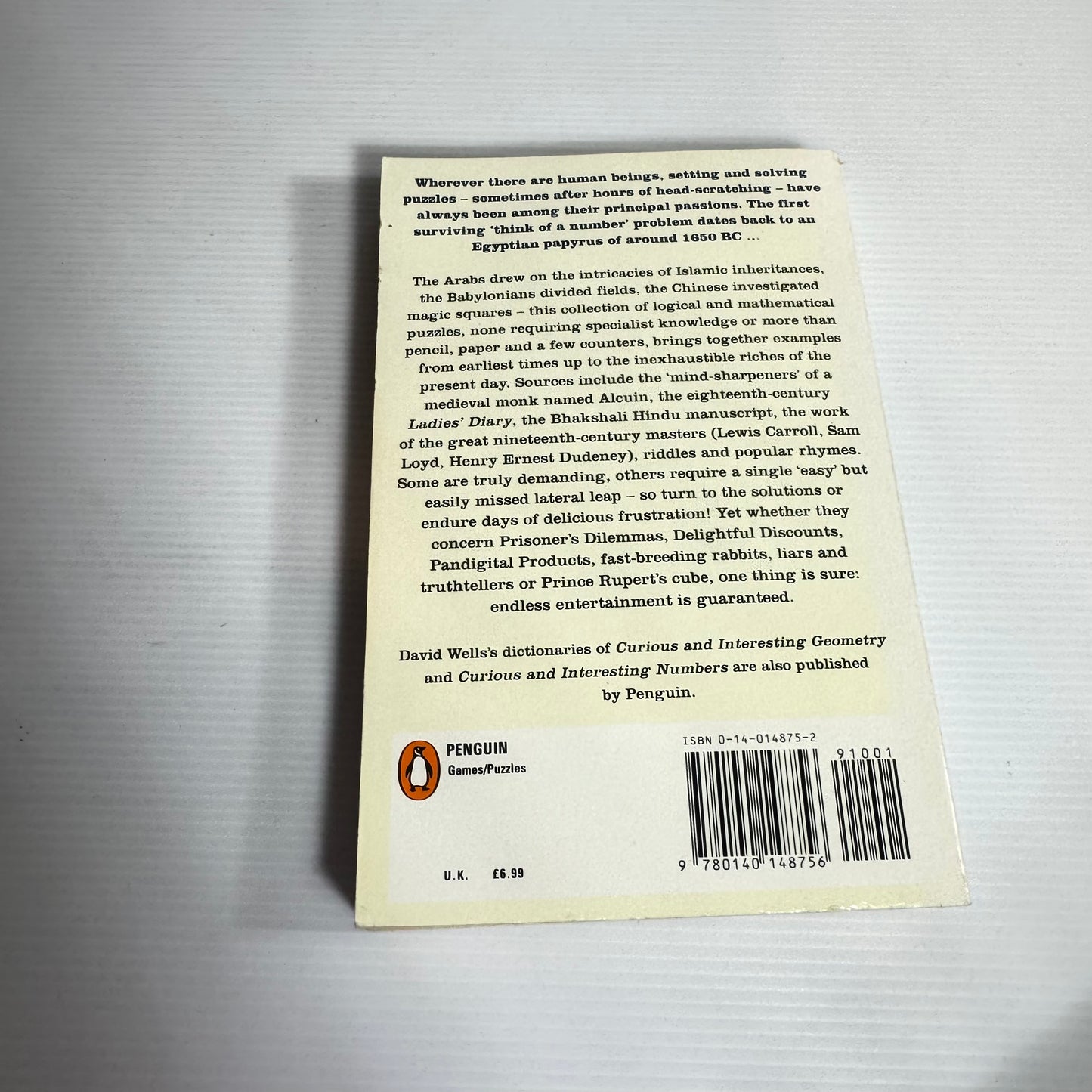 The Penguin Book of Curious and Interesting Puzzles - David Wells