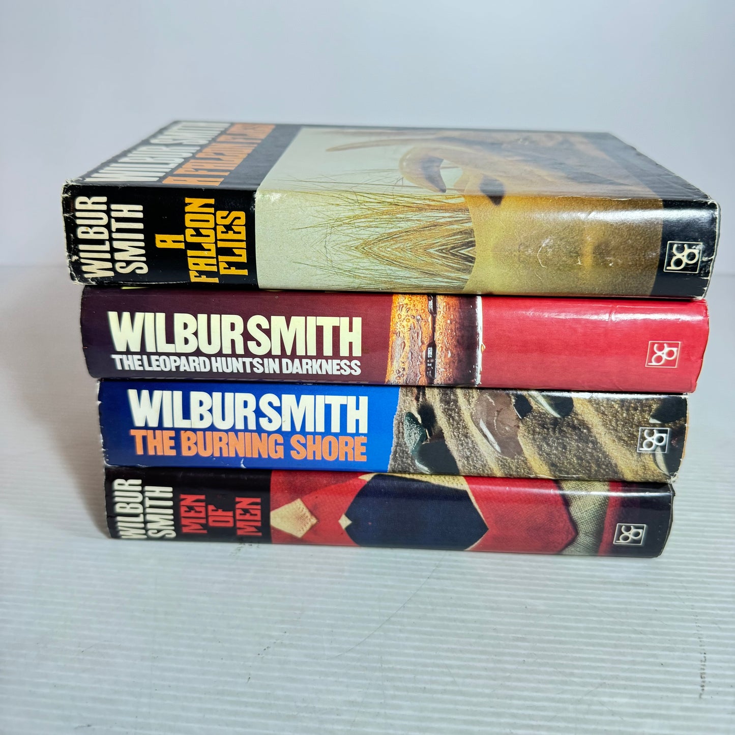 Wilbur Smith Vintage Medium Hardcover x 4 : The Leopard Hunts In the Darkness, Men of Men, A Falcon Flies, The Burning Shore (Vintage 1980's)(2967)