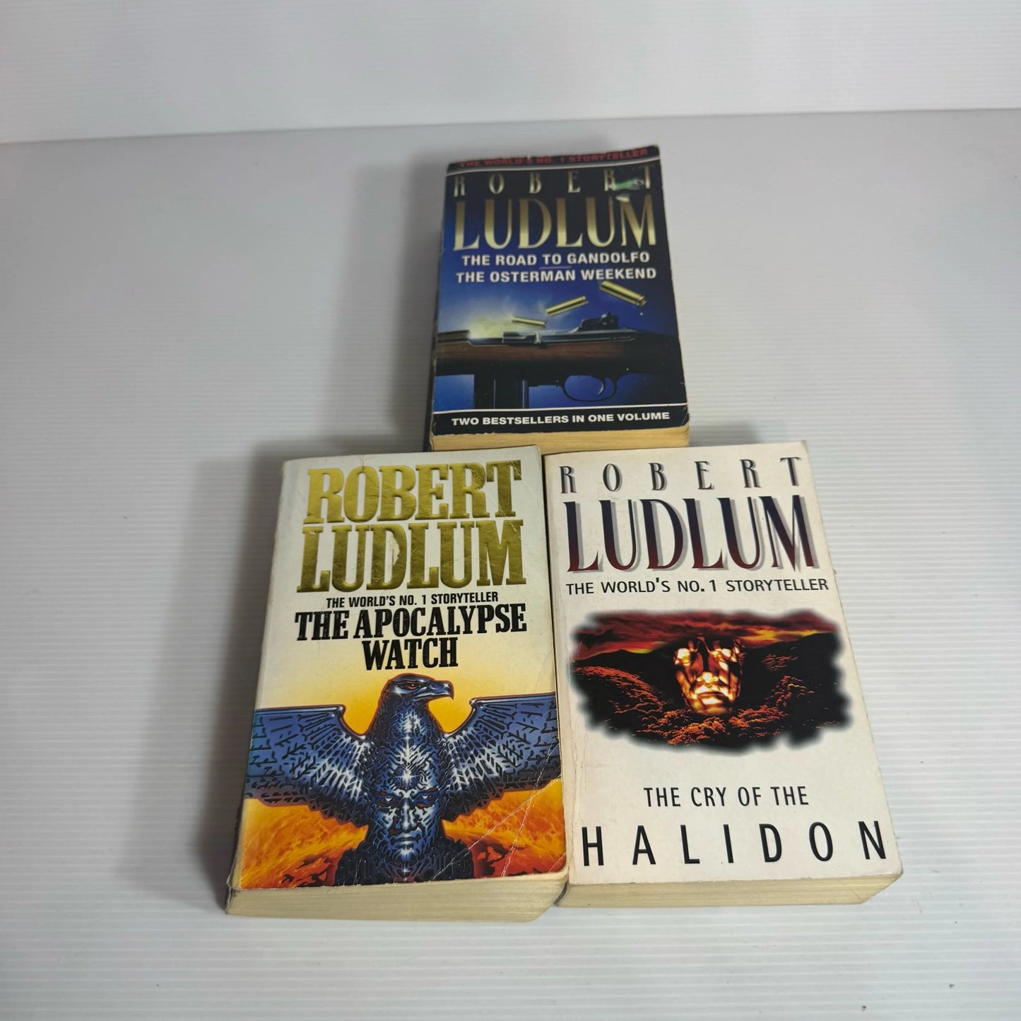 Robert Ludlum Book Bundle x 3 Books x 4 Stories : The Road to Gandolfo, The Osterman Weekend, The Apocalypse Watch, The Crey of the Halidon(2339)