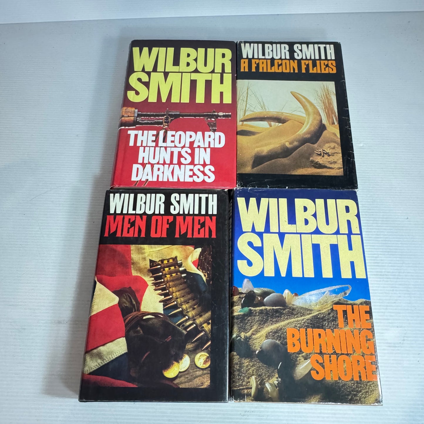 Wilbur Smith Vintage Medium Hardcover x 4 : The Leopard Hunts In the Darkness, Men of Men, A Falcon Flies, The Burning Shore (Vintage 1980's)(2967)