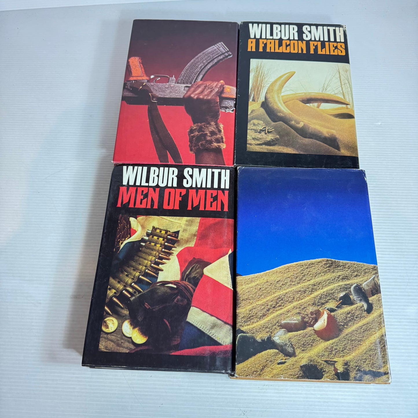 Wilbur Smith Vintage Medium Hardcover x 4 : The Leopard Hunts In the Darkness, Men of Men, A Falcon Flies, The Burning Shore (Vintage 1980's)(2967)