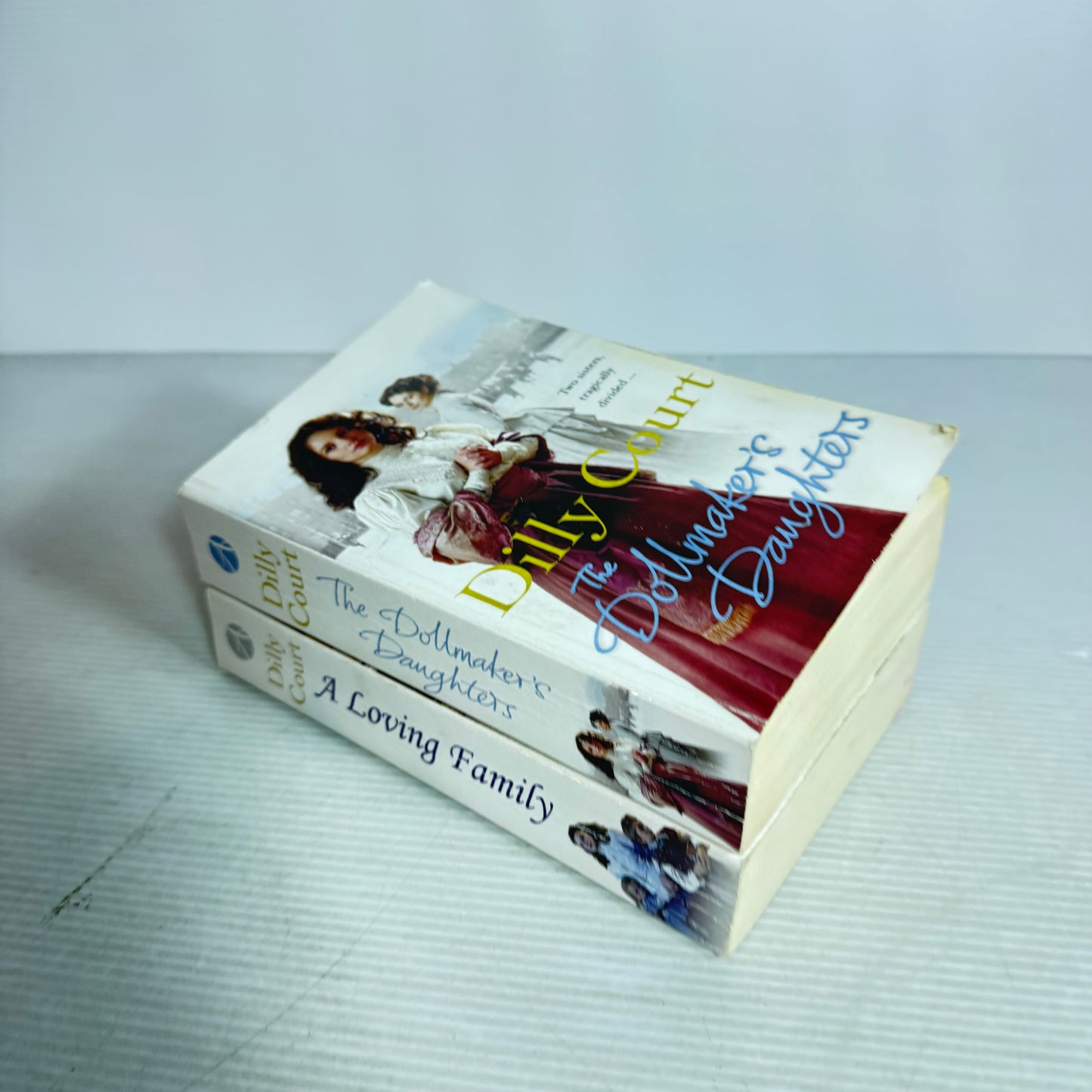 Dilly Court Book Bundle x 2 : The Dollmaker's Daughters & A Loving Family (3033)