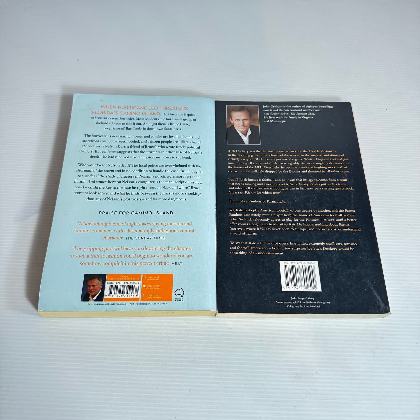 John Grisham Book Bundle x 2 : Playing for Pizza & Camino Winds (2430)