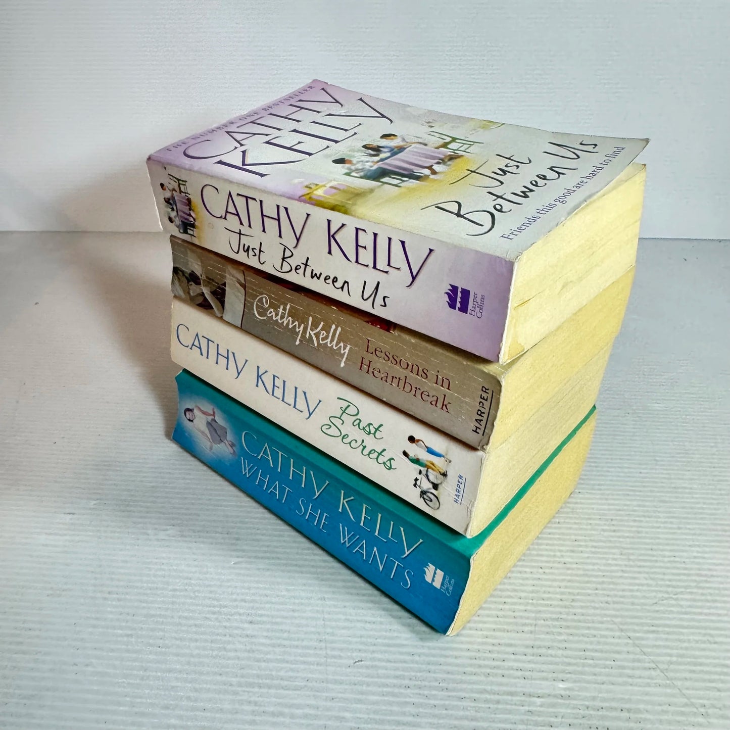 Cathy Kelly Book Bundle x 4 (645) Just Between Us, Lessons in Heartbreak, Past Secrets, What She Wants